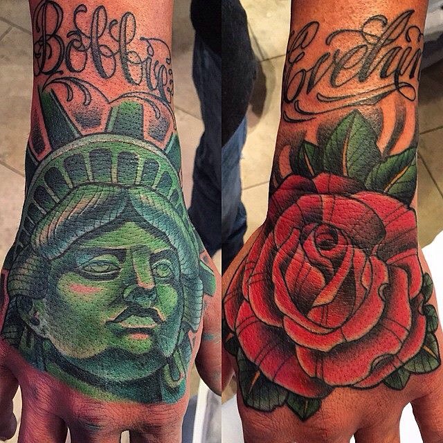 Hand tattoos by Terry Ribera @terryribera #tattooworkers @tattoo.workers #statueoflibertytattoo #rosetattoo #handtattoo #RemingtonTattoo