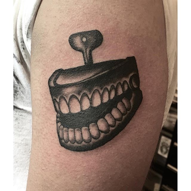 Chattering teeth tattoo by @jasmineworth to book a tattoo with Jasmine, please contact her at JasmineWorthTattoos@gmail.com #joketeeth #chatteringteethtattoo #toothtattoo #teethtattoo #joketattoo