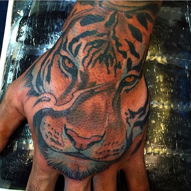 Hand Tiger by Nathaniel Gann | Remington Tattoo Parlor