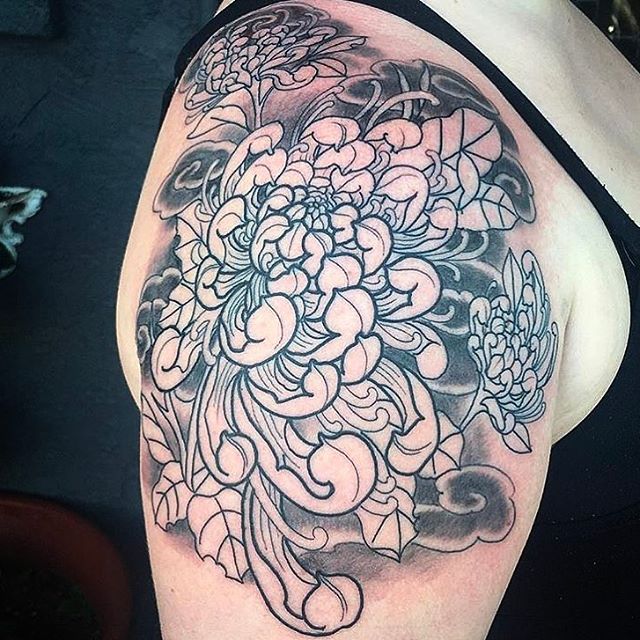 Progress shot of a tattoo by @chriscockadoodledo #flowertattoo #wip #linework #shading #sleeve #sandiegotattoo #sandiegotattooartist